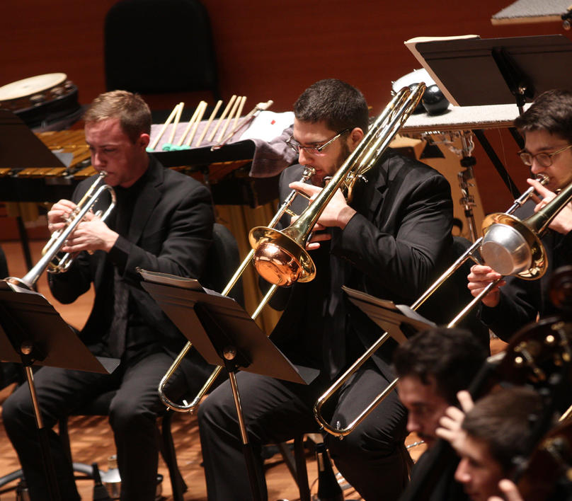 Brass section performing in the orchestra